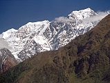 402 Nilgiri North, Central, And South From Lete From Lete, I looked up at a broad snow covered mountain. From left to right Nilgiri North (7061m), Nilgiri Central (6940m) and Nilgiri South (6839m) shone in the early afternoon sun.